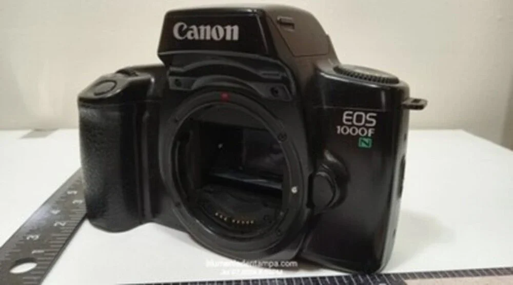 Canon EOS 1000F N 35mm SLR film camera body in black.